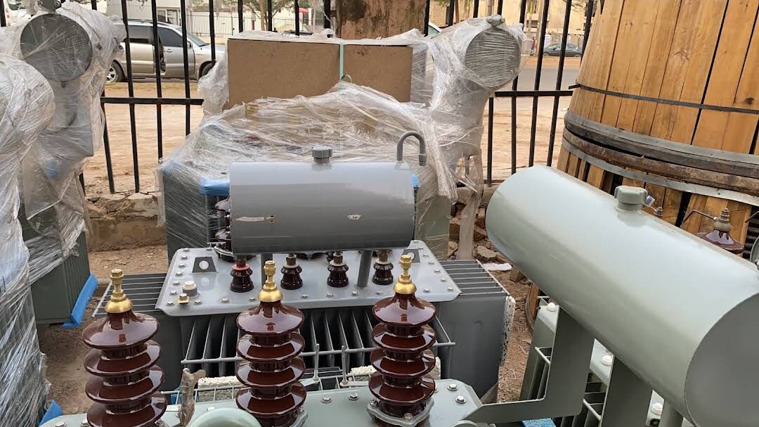 Close view of transformer bushings and conservator tank